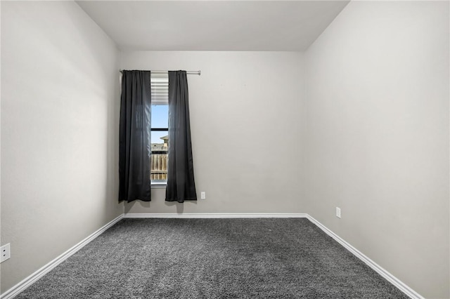 empty room with baseboards and carpet floors