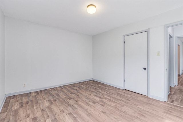 empty room with light wood-type flooring