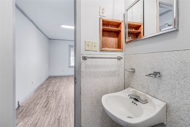 bathroom with sink and hardwood / wood-style flooring