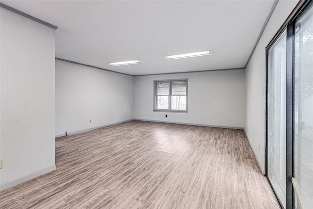 spare room with light hardwood / wood-style floors