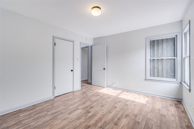 unfurnished room featuring light hardwood / wood-style floors