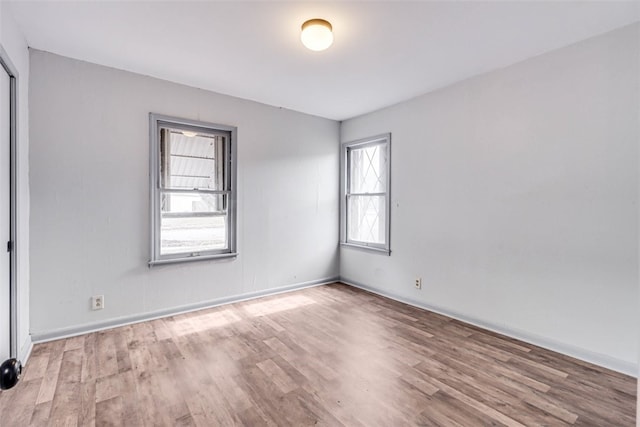 unfurnished room featuring light hardwood / wood-style floors