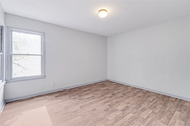 spare room with light hardwood / wood-style floors