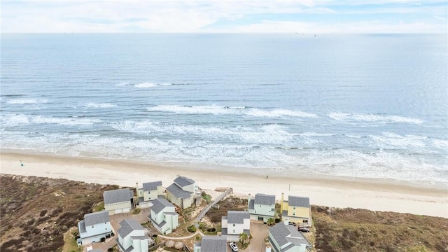 birds eye view of property featuring a view of the beach and a water view