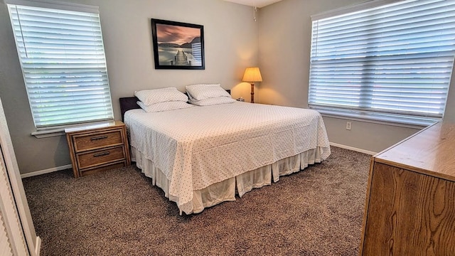 carpeted bedroom featuring baseboards