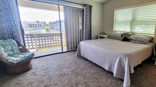 carpeted bedroom with access to outside