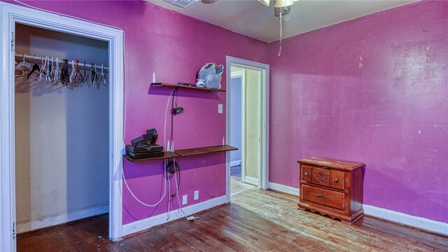 interior space featuring hardwood / wood-style flooring and ceiling fan