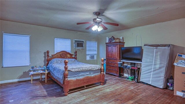 bedroom with hardwood / wood-style floors and ceiling fan