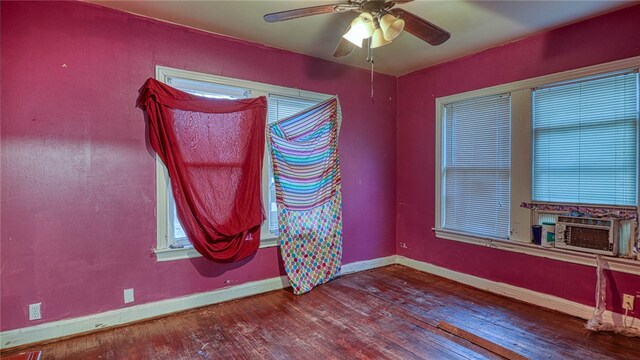 empty room featuring hardwood / wood-style floors, cooling unit, and ceiling fan