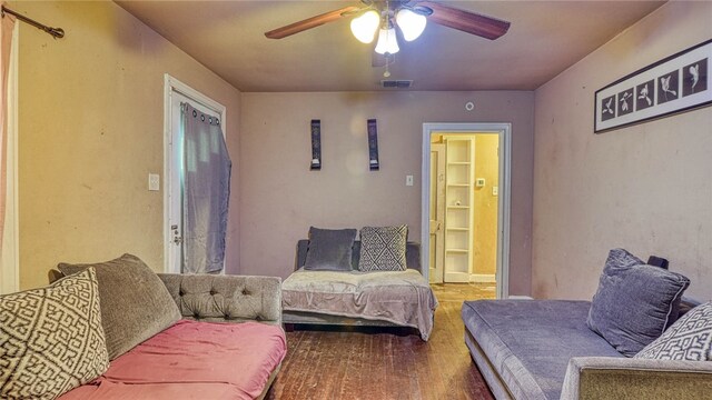 interior space with ceiling fan