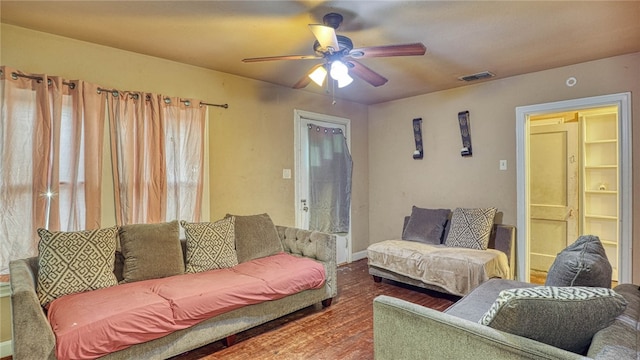 living room featuring hardwood / wood-style flooring and ceiling fan