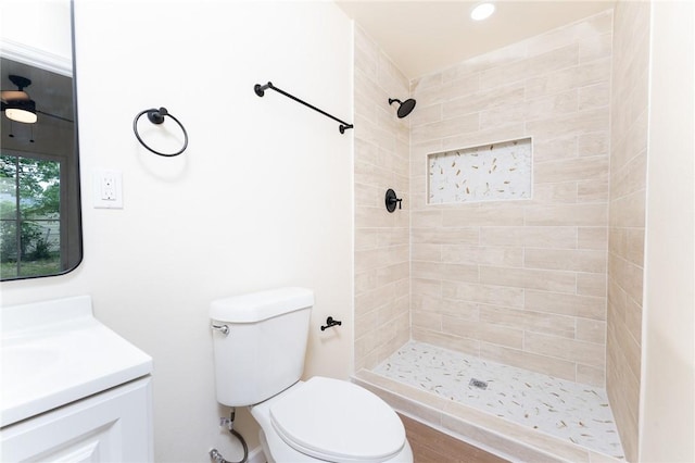 641 Caddo St, Corpus Christi, TX 78412 - bathroom featuring vanity, toilet, a tile shower, and recessed lighting