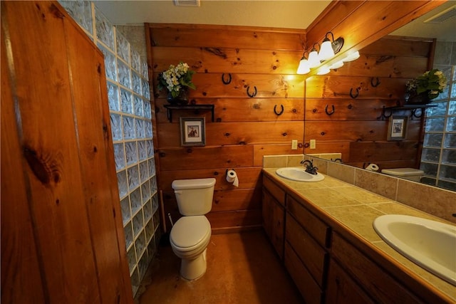 bathroom featuring toilet and vanity