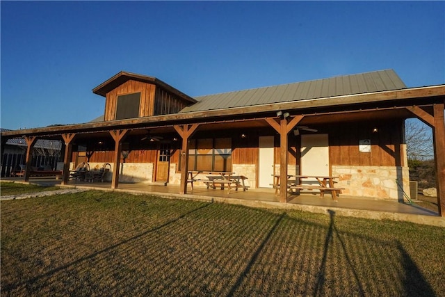 view of community with a lawn and a patio