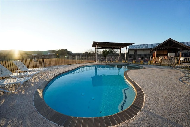 view of swimming pool with a gazebo and a patio