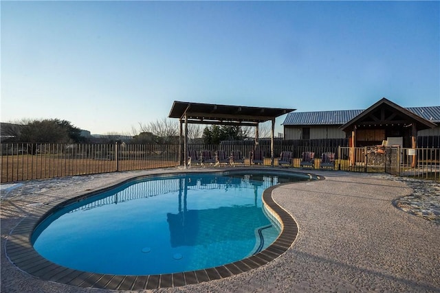 view of swimming pool with a gazebo and a patio