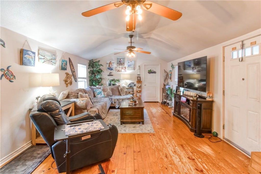 2222 S Commercial St, Aransas Pass, TX 78336 - living area featuring a ceiling fan, light wood-style flooring, and lofted ceiling