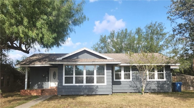 back of house featuring a yard