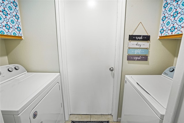 washroom featuring washer and dryer and tile patterned floors