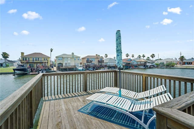 view of dock with a deck with water view