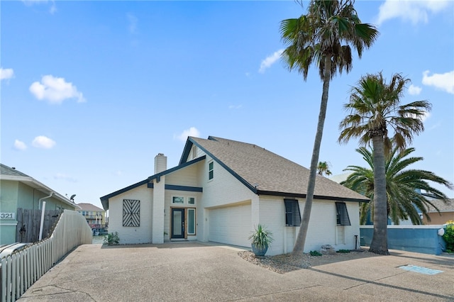 back of house featuring a garage