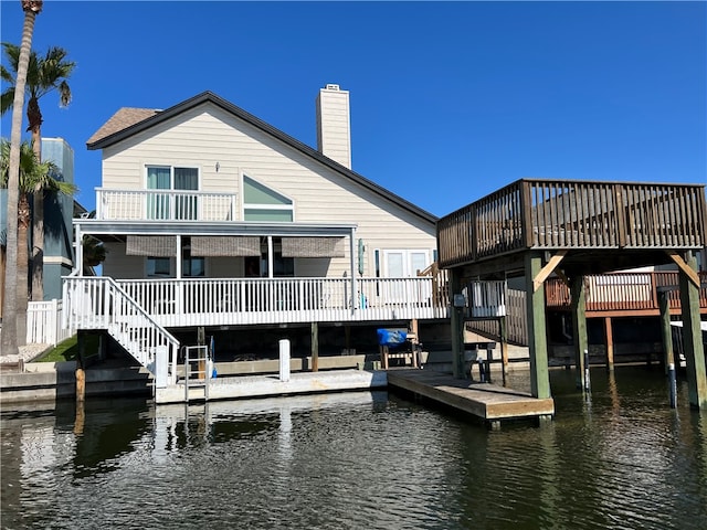 dock area with a deck with water view