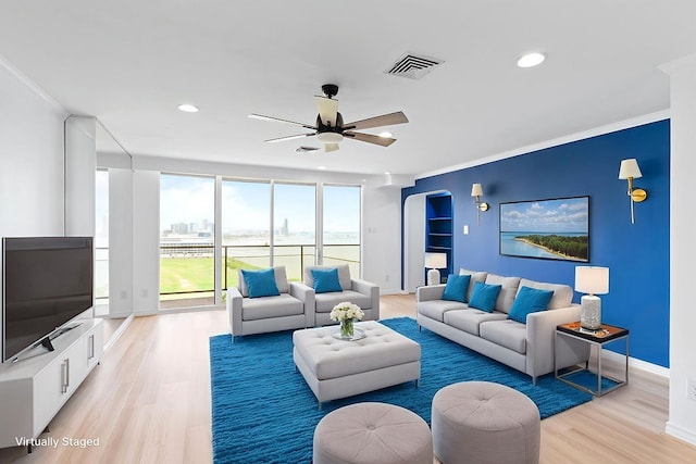 1400 Ocean Dr Unit 904-B, Corpus Christi, TX 78404 - living area featuring ornamental molding, ceiling fan, light wood-style flooring, recessed lighting, and arched walkways