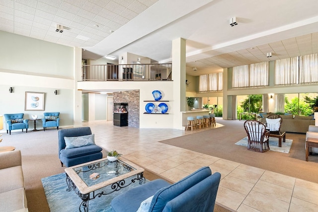 1400 Ocean Dr Unit 904-B, Corpus Christi, TX 78404 - carpeted living area featuring a towering ceiling, tile patterned floors, and a fireplace