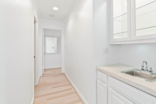 1400 Ocean Dr Unit 904-B, Corpus Christi, TX 78404 - corridor with a sink and light wood-style flooring