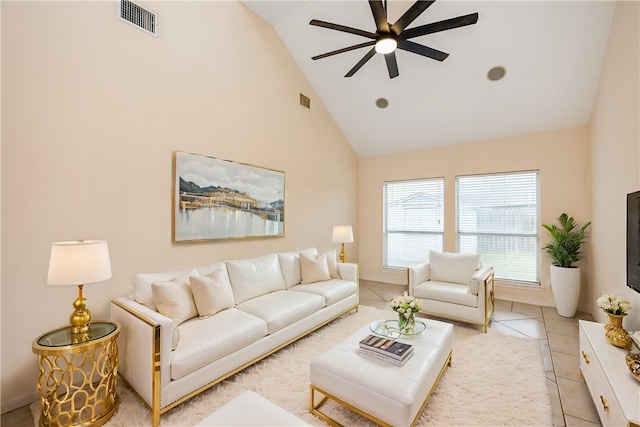 living room with ceiling fan, tile patterned flooring, and high vaulted ceiling