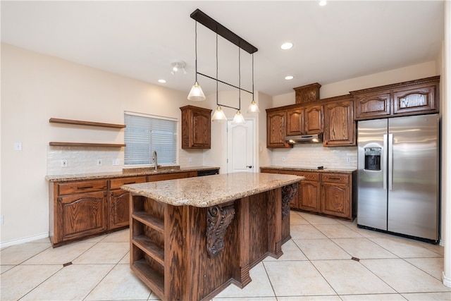 kitchen with light tile patterned flooring, a center island, stainless steel fridge with ice dispenser, and backsplash