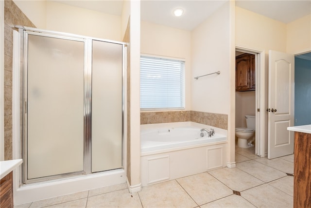 full bathroom featuring tile patterned flooring, vanity, toilet, and independent shower and bath