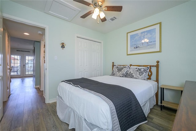 bedroom with dark wood-type flooring, french doors, ceiling fan, and a closet