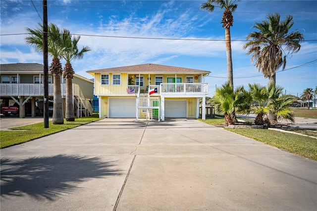 view of front of house featuring a porch and a garage