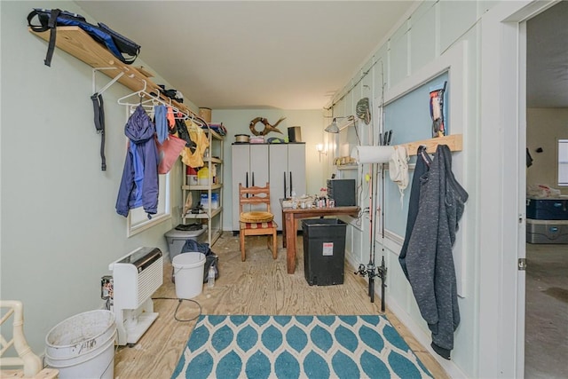 interior space featuring heating unit and light hardwood / wood-style flooring