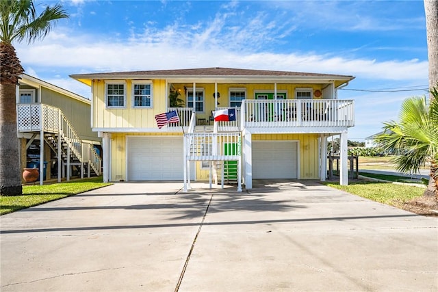 beach home featuring a garage and a porch