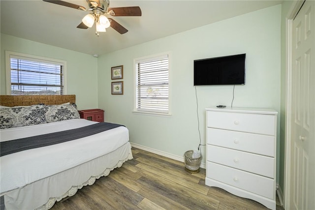 bedroom with hardwood / wood-style flooring and ceiling fan