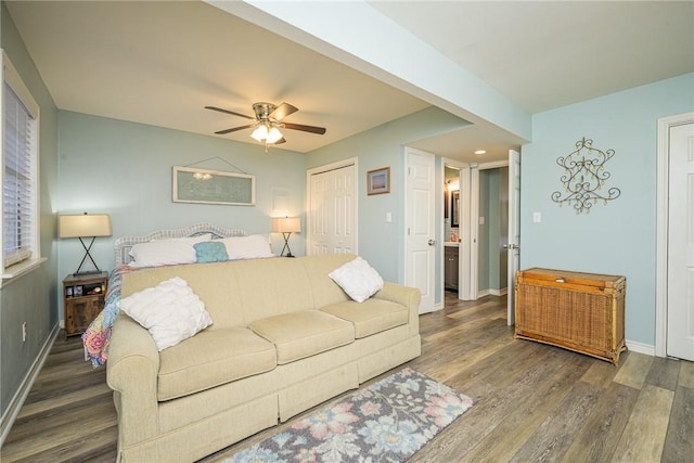 bedroom featuring ceiling fan and dark wood-type flooring