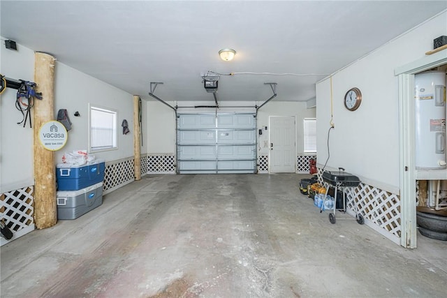 garage featuring a garage door opener and electric water heater