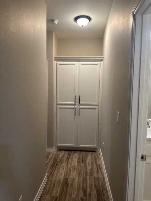 hall with dark hardwood / wood-style floors