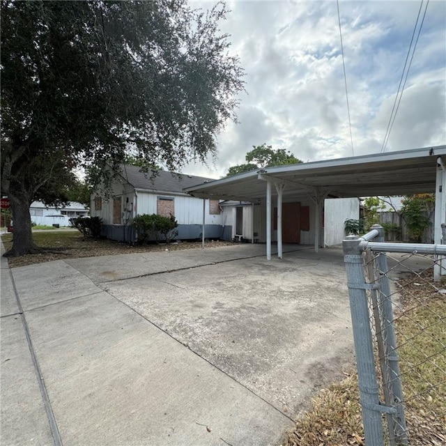 view of home's exterior featuring a carport