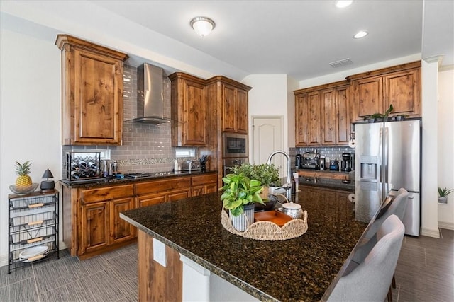 1805 Bay Landing Dr, Portland, TX 78374 - kitchen with stainless steel appliances, wall chimney exhaust hood, brown cabinets, and recessed lighting