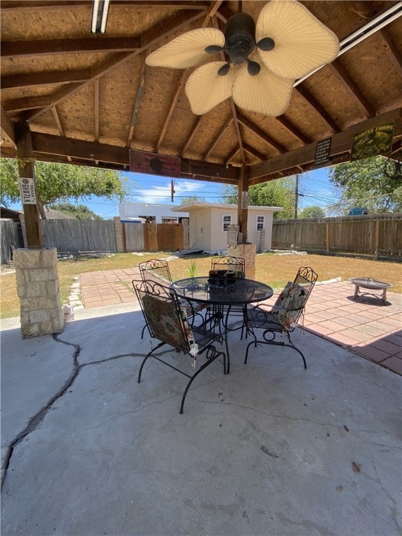 1038 Dorthy Dr, Corpus Christi, TX 78412 - fenced backyard featuring outdoor dining space, a gazebo, a patio area, and a ceiling fan