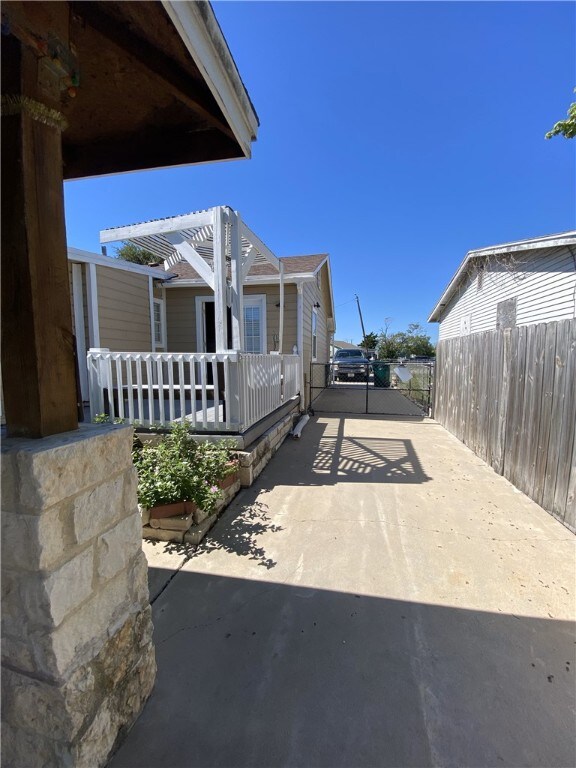 1038 Dorthy Dr, Corpus Christi, TX 78412 - view of patio featuring concrete driveway and a gate