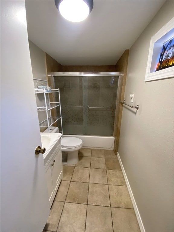 1038 Dorthy Dr, Corpus Christi, TX 78412 - bathroom featuring vanity, tile patterned floors, and combined bath / shower with glass door