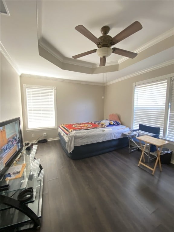 1038 Dorthy Dr, Corpus Christi, TX 78412 - bedroom featuring a tray ceiling, wood finished floors, crown molding, and a ceiling fan