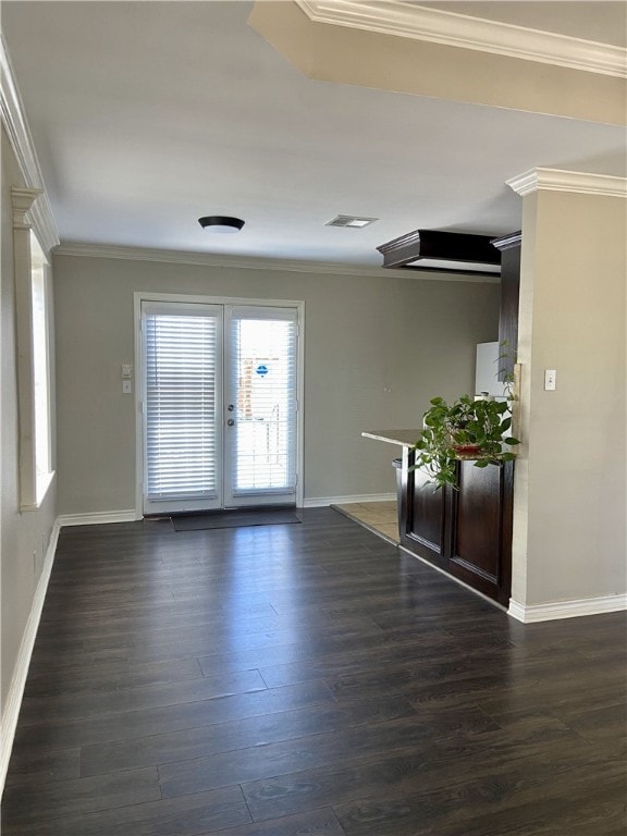 unfurnished room featuring dark hardwood / wood-style floors and ornamental molding