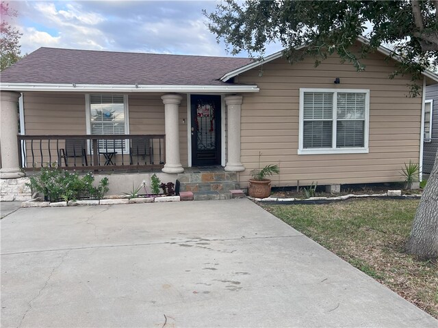 1038 Dorthy Dr, Corpus Christi, TX 78412 - view of front of property featuring covered porch and roof with shingles