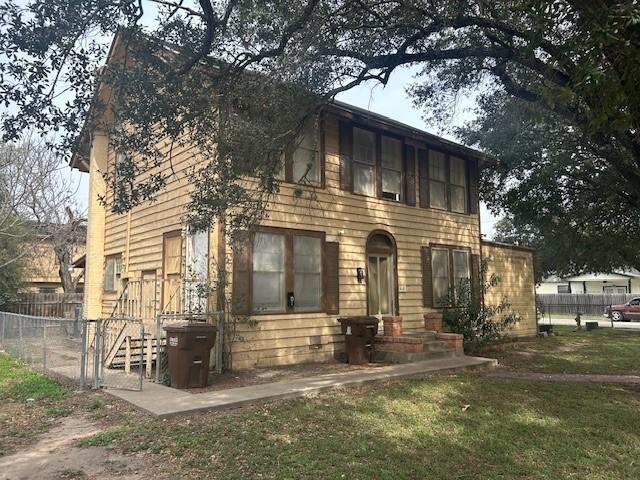 colonial-style house with a front yard