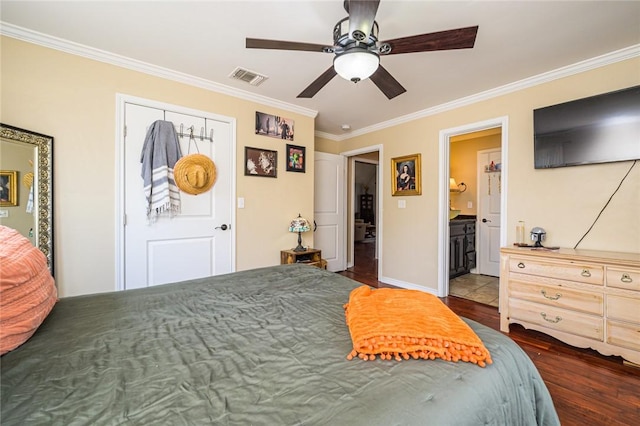 123 Bishop Rd, Rockport, TX 78382 - bedroom with ornamental molding, wood finished floors, baseboards, ceiling fan, and connected bathroom
